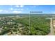 Aerial view highlighting property location in a lush, green neighborhood at 1328 Needle Palm Dr, Edgewater, FL 32132