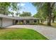 House with paver driveway and landscaping at 1328 Needle Palm Dr, Edgewater, FL 32132