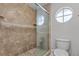 Clean bathroom with updated shower and tile flooring at 1328 Needle Palm Dr, Edgewater, FL 32132