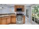 Kitchen features stainless steel appliances and ample wood cabinetry at 1328 Needle Palm Dr, Edgewater, FL 32132