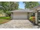Attached garage with paver driveway at 1328 Needle Palm Dr, Edgewater, FL 32132