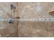 Shower with double shower heads and tile surround at 1328 Needle Palm Dr, Edgewater, FL 32132