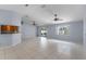 Open living space with tile floors and access to patio at 1328 Needle Palm Dr, Edgewater, FL 32132