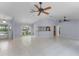 Bright and airy living room with tile flooring and high ceilings at 1328 Needle Palm Dr, Edgewater, FL 32132