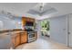 Bright kitchen with stainless steel appliances and wood cabinets at 1328 Needle Palm Dr, Edgewater, FL 32132