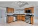 Well-equipped kitchen with modern appliances and wood cabinets at 1328 Needle Palm Dr, Edgewater, FL 32132