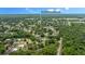 Aerial view showing home's location in a residential neighborhood near water at 1328 Needle Palm Dr, Edgewater, FL 32132
