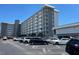 Exterior view of a multi-story building with parking at 101 N Riverside Dr # 611, New Smyrna Beach, FL 32168