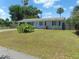 Single story home with driveway and yard at 1846 Royal Palm Dr, Edgewater, FL 32141