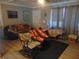 Living room with rocking chairs and couches at 1846 Royal Palm Dr, Edgewater, FL 32141