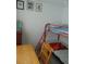 Bedroom with a bunk bed and adjacent table at 1846 Royal Palm Dr, Edgewater, FL 32141