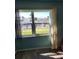Bedroom with water view and window curtains at 2100 N Peninsula Ave # 1050, New Smyrna Beach, FL 32169