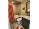 Clean bathroom with tub, toilet and vanity at 2100 N Peninsula Ave # 1050, New Smyrna Beach, FL 32169
