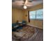 Cozy bedroom with blue accent chairs and a round rug at 2100 N Peninsula Ave # 1050, New Smyrna Beach, FL 32169