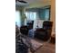 Relaxing living room featuring two leather recliners at 2100 N Peninsula Ave # 1050, New Smyrna Beach, FL 32169