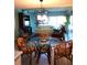 Bright dining area with glass table and wicker chairs at 2100 N Peninsula Ave # 1050, New Smyrna Beach, FL 32169