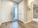 Light and airy entryway with tile flooring, double closet and a view to balcony at 1 Riverwalk Dr # 202, New Smyrna Beach, FL 32169