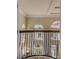 View from a balcony overlooking a two-story home's interior, showcasing an open floor plan and high ceilings at 5090 Riverside Dr # 105, Port Orange, FL 32127