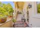 Ground level entrance with steps, landscaping, and a small patio at 5090 Riverside Dr # 105, Port Orange, FL 32127