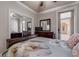 Bright bedroom with a queen bed, mirrored closet doors, and private access to courtyard at 5090 Riverside Dr # 105, Port Orange, FL 32127