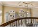 View from a balcony overlooking a two-story home's interior, showcasing an open floor plan and high ceilings at 5090 Riverside Dr # 105, Port Orange, FL 32127