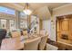 Elegant dining area with a large table and access to the home elevator at 5090 Riverside Dr # 105, Port Orange, FL 32127