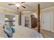 Main bedroom with a king-size bed, walk-in closet, and private bathroom access at 5090 Riverside Dr # 105, Port Orange, FL 32127