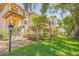 Mediterranean-style building with lush landscaping and brick walkways at 5090 Riverside Dr # 105, Port Orange, FL 32127