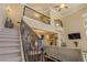 Impressive staircase with wrought-iron railings leading to upper levels at 5090 Riverside Dr # 105, Port Orange, FL 32127