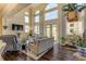 Spacious living room with high ceilings, hardwood floors, and lots of natural light at 5090 Riverside Dr # 105, Port Orange, FL 32127