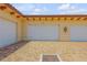 Attached two-car garage with paver driveway at 5090 Riverside Dr # 105, Port Orange, FL 32127