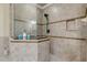 Large walk-in shower with glass enclosure and neutral tile at 5090 Riverside Dr # 105, Port Orange, FL 32127