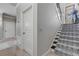 Elegant staircase with patterned carpet runner leading to the upper level at 5090 Riverside Dr # 105, Port Orange, FL 32127