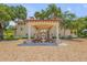 Building entrance with covered walkway, fountain, and brick pavers at 5090 Riverside Dr # 105, Port Orange, FL 32127