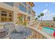 Private balcony with seating and pool view at 5090 Riverside Dr # 105, Port Orange, FL 32127
