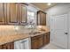 Kitchen with granite countertops, stainless steel appliances, and ample wood cabinets at 5090 Riverside Dr # 105, Port Orange, FL 32127
