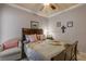 Charming bedroom featuring a comfortable bed and ceiling fan at 5090 Riverside Dr # 105, Port Orange, FL 32127