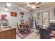 Home office with desk, seating, mini-fridge, and access to outdoor patio at 5090 Riverside Dr # 105, Port Orange, FL 32127