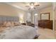 Bright bedroom with a comfortable bed and relaxing chair at 5090 Riverside Dr # 105, Port Orange, FL 32127