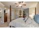 Main bedroom showcasing a king-size bed, plenty of natural light, and a private balcony at 5090 Riverside Dr # 105, Port Orange, FL 32127