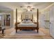 Main bedroom featuring a king-size bed, ceiling fan and ample closet space at 5090 Riverside Dr # 105, Port Orange, FL 32127