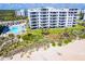Aerial view of beachfront condo building with pool and ocean access at 5301 S Atlantic Ave # 630, New Smyrna Beach, FL 32169