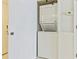 Stackable washer and dryer in a closet at 5301 S Atlantic Ave # 630, New Smyrna Beach, FL 32169