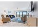 Living room with ocean view, featuring ample seating and a large TV at 5301 S Atlantic Ave # 630, New Smyrna Beach, FL 32169