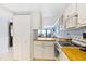 Kitchen with ocean view, white cabinets and an electric stove top at 5301 S Atlantic Ave # 630, New Smyrna Beach, FL 32169
