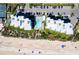 Aerial view of condo building, pool, and beach access at 5301 S Atlantic Ave # 630, New Smyrna Beach, FL 32169