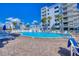 Relaxing pool area with ample lounge chairs at 5301 S Atlantic Ave # 630, New Smyrna Beach, FL 32169