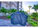Community grill with cover, nestled in a landscaped courtyard at 5301 S Atlantic Ave # 630, New Smyrna Beach, FL 32169