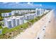 Aerial view of beachfront condos, showing the ocean and surrounding area at 5301 S Atlantic Ave # 630, New Smyrna Beach, FL 32169