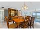 Spacious dining area with wooden table and chairs and ocean view at 5301 S Atlantic Ave # 630, New Smyrna Beach, FL 32169